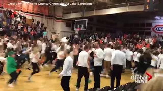 High school crowd goes wild after improbable buzzer beater wins game
