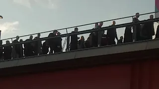 West Ham United fans walking on bridge in Stratford