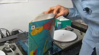 Placing Vinyl Record Into Sleeve