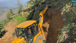 A Small Mountain Village Road Construction with JCB Backhoe