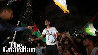 Palestinians mark ceasefire by celebrating on the streets of Gaza