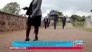 President Kagame and first lady in the rain at Kigali Genocide Memorial