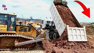 Great action Team Dump truck Waiting unloading soil with Stone Land Filling Up Dozer working part22