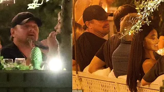 Leonardo DiCaprio is surrounded by models during late night dinner in Paris