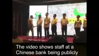 Employees publicly spanked for poor performance in china.