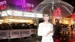 Lily Collins braves the rain in a dazzling white mini dress at the screening of hit Netflix series