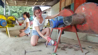 Girl repairs multi-purpose food slicer for livestock - Mechanical girl restores old machine