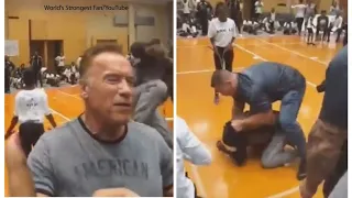 RAW VIDEO: Arnold Schwarzenegger kicked in back