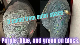 Blue, Pink, Purple, and Green on Blackout tattoo.