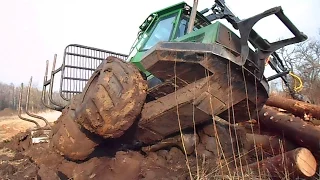 John Deere 810D stuck in  mud