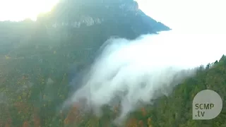 Sea of clouds flows like a waterfall in China's Hubei province