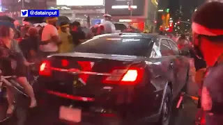 Car drives through Black Lives Matter protesters in Times Square