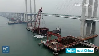 Box girders installed on China's first cross-sea railway bridge