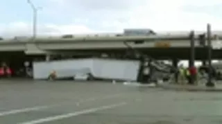 Semi-truck flips off Texas overpass and crushes sedan; both drivers OK