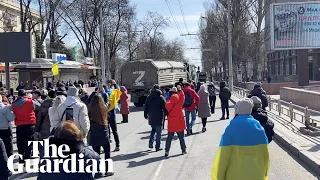 'Go home!': Ukrainian protesters confront Russian military vehicles in Kherson