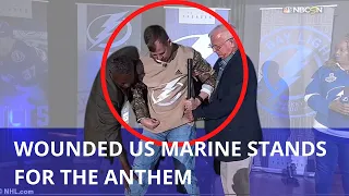 Stunning moment wheelchair bound veteran Colonel STANDS for the National Anthem at Stanley Cup sport