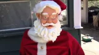 SHOCKING! Broken Gemmy Dancing Santa is caught moving mouth and making noise at the same time