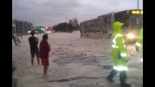 Police almost killed by car jumping out of sea foam in Queensland Australia cyclone floods