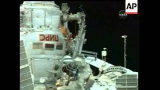 Two members of the international space station crew took a daring space walk on Thursday to cut into