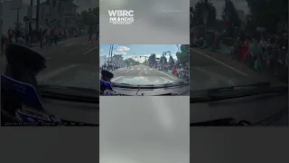 CAUGHT ON CAM: Road raged driver barrels through parade route.