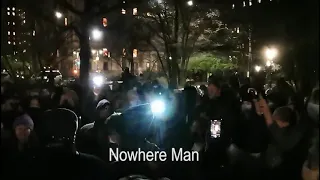 In Memory of John Lennon. New Yorkers singing at Strawberry fields in Central Park. Dec.08.2020