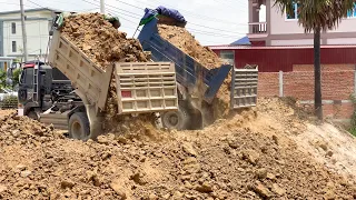 The Impressing Land Filling Operator Komatsu D20P Push Soil, 5ton Dump Truck Unloading Soil