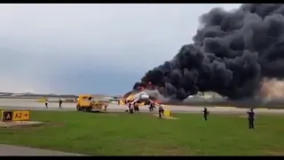 Russian plane lands in flames, killing 13