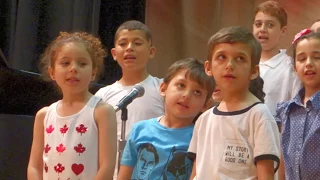 Syrian Refugee Children sing "We love Canada" in Arabic, English & French