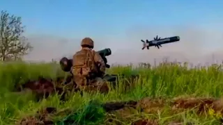 A Ukrainian soldiers hits Russian armor using a Javelin anti-tank missile