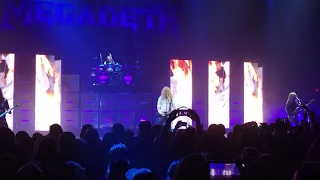 Fan jumps on stage and steals pick from Dave Mustaine