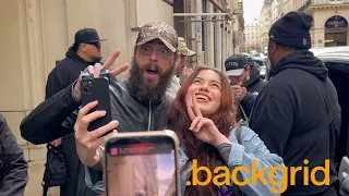 Post Malone greets fans as he departs his hotel in Paris, France