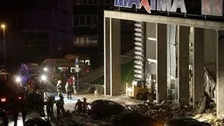 Latvia supermarket collapse: emergency workers search for survivors