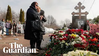 Alexei Navalny’s mother visits his grave in Moscow
