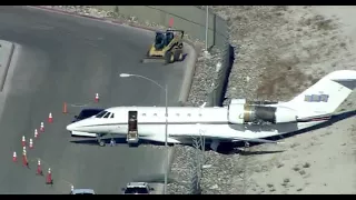 Plane rolls through fence after maintenance worker forgets to set the brakes