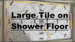 Large tile on shower floor. Tile Relief Cuts. Shower Floor Tile. Shower tile.