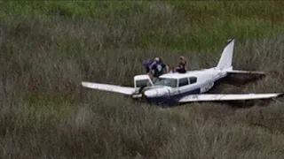 Small plane runs out of fuel, crashes in Brunswick marsh