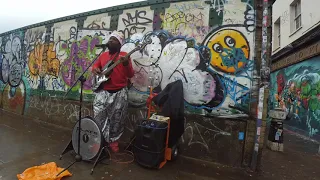 Street musician playing Jammin in Brick Lane