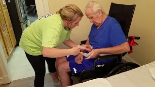 Stroke patient transfer from wheelchair to bed.