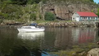 Water skiing behind our 80´s double-ender Sollux 24 AC boat