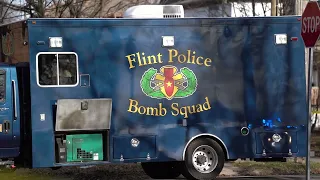 Flint Police Bomb Squad respond to a suspicious package outside a house