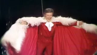 Leapin' Lizards: Liberace sings "I'll be seeing you" and flyies over the audience (1978)