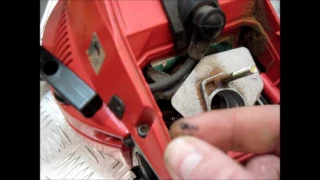 Chainsaw stalls when pressing on gas. How to adjust the carburetor