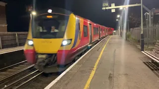 Southwestern Railway train pulling into Hampton ( London ) to London Waterloo at 23:21 Night service