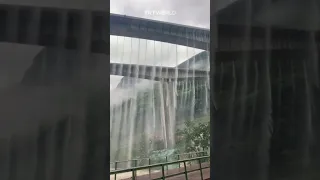 Bridge overflows with water after heavy rain in China