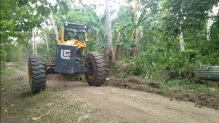 Skill grader operator ditching and clearing on road, (Equipment & Operator Channel)