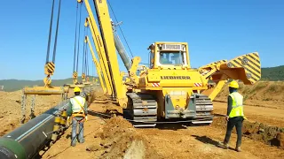 Gas Pipeline Construction - Pipeline Lowering in to the trench in normal terrain.