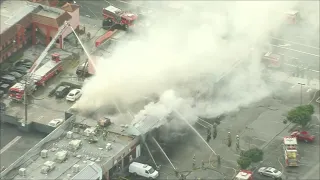 Live Video: Firefighters battle commercial building fire in South Gate