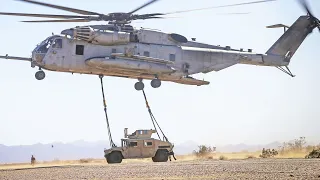 Sikorsky CH-53E Super Stallion Lifting the Load with Support from Soldiers, United States Marines