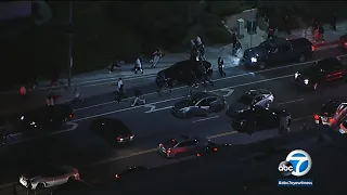 Crowd disperses as LAPD swoops in to break up Granada Hills street takeover | ABC7