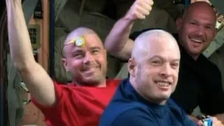 Raw: NASA Astronauts Shave Head for USA Loss